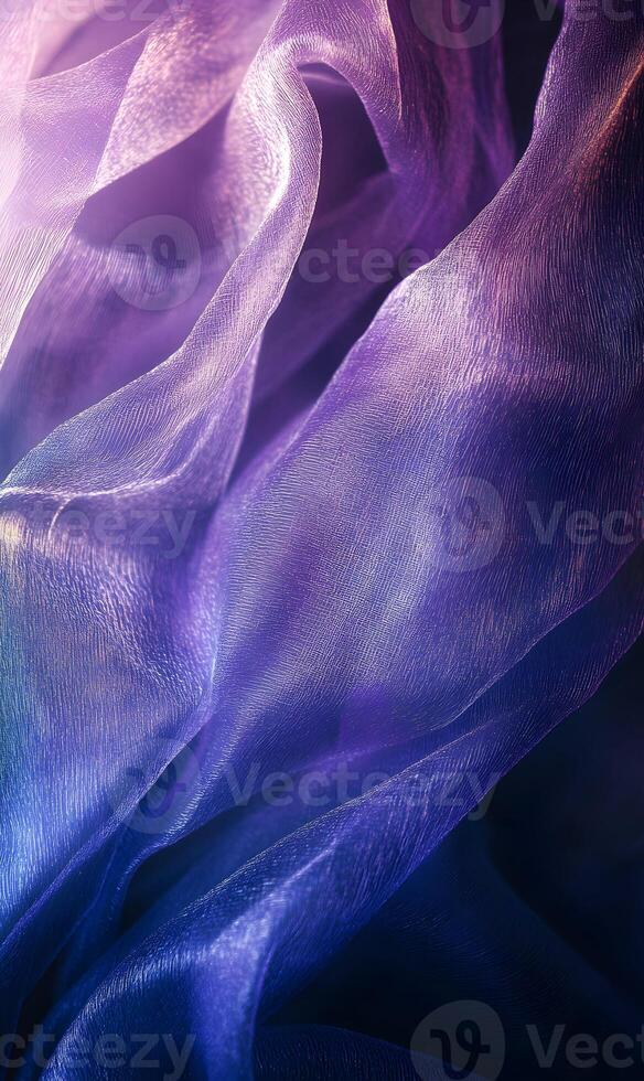 Elegant purple iridescent fabric ripples creating a mesmerizing translucent textile effect photo