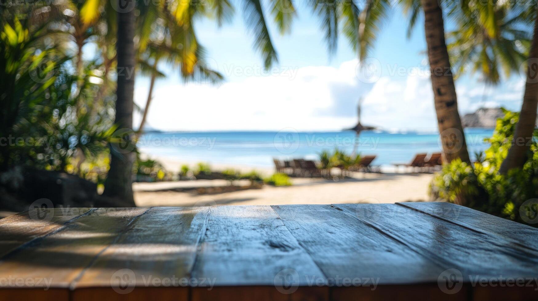 Tropical paradise beach getaway with wooden table foreground, idyllic scenic caribbean vacation photo
