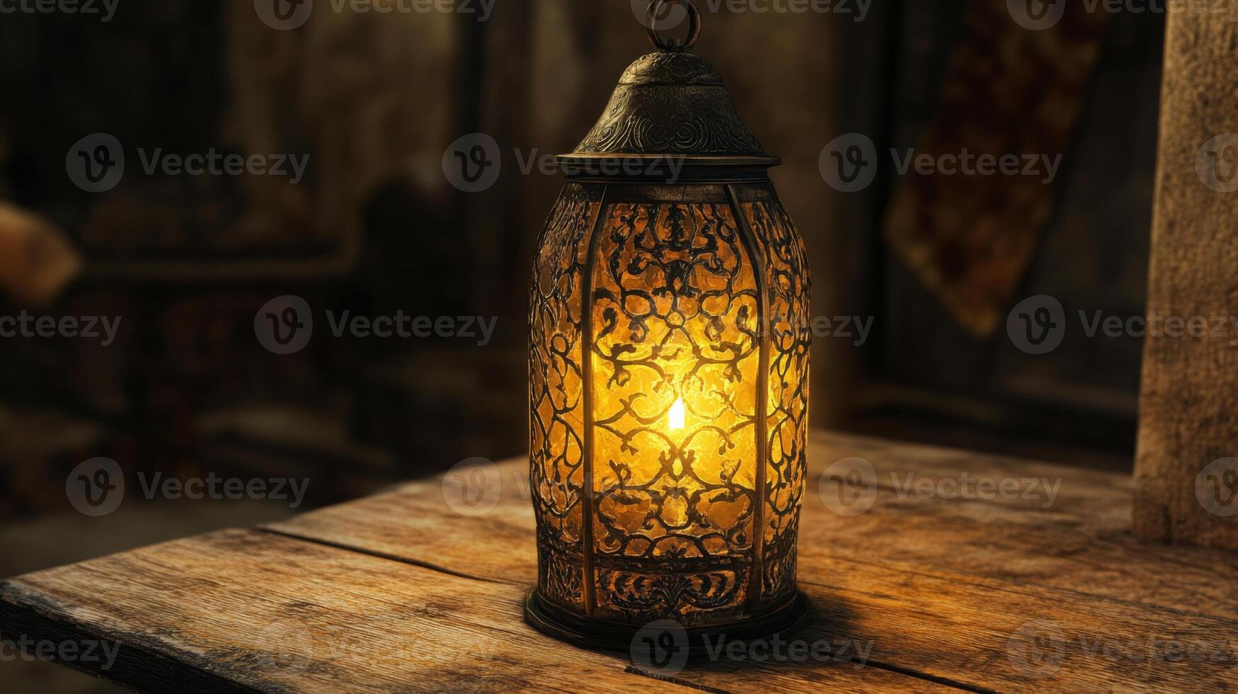 Vintage ornate lantern casting a warm glow on rustic wood surface in dim lit ambiance photo