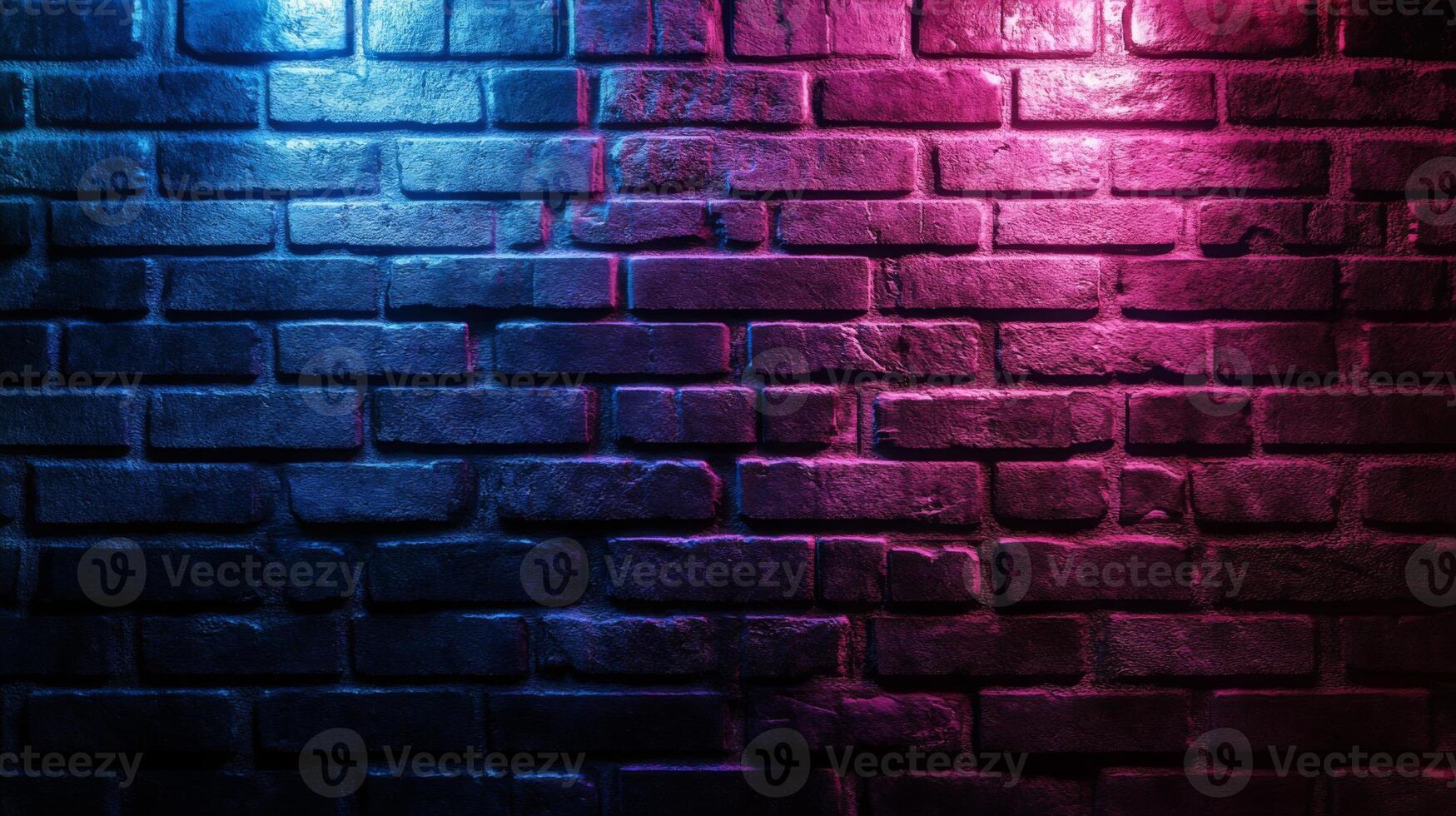 Illuminated brick wall in contrasting blue and pink tones offering an urban texture photo
