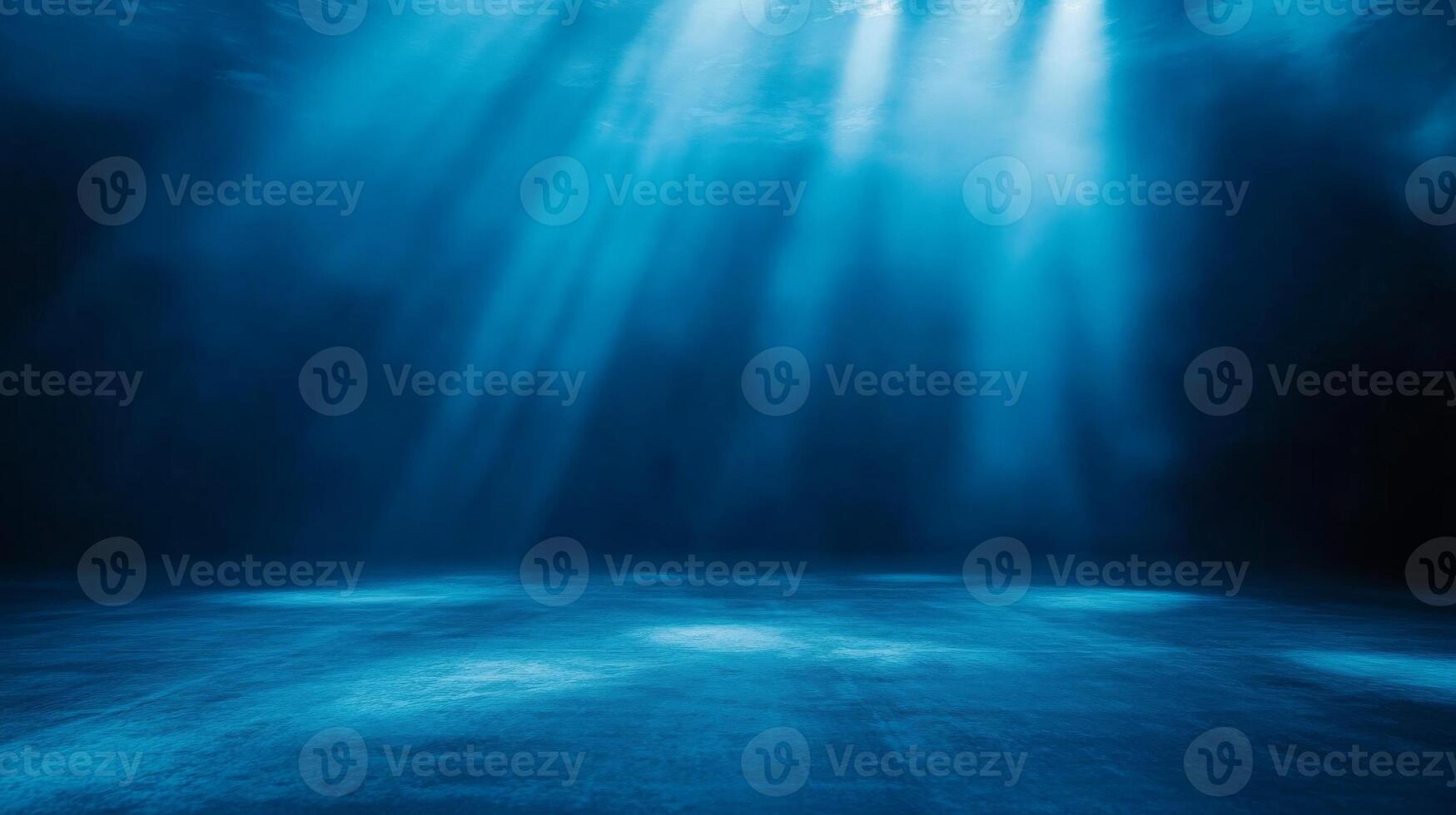 Sunlight filtering underwater casting ethereal rays on the seabed creating a serene ambiance photo