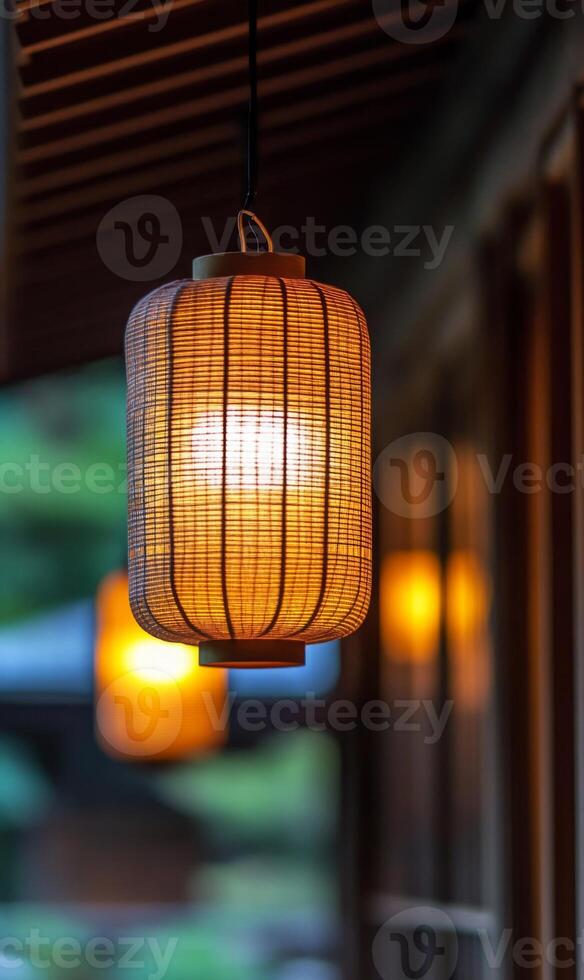 Glowing lantern illuminates a peaceful courtyard creating a warm ambiance and a sense of tranquility photo