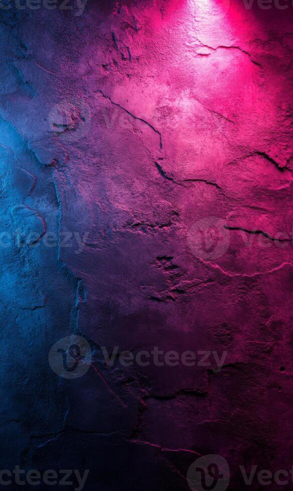 Textured stone wall illuminated by vibrant pink and blue light creating a captivating backdrop photo