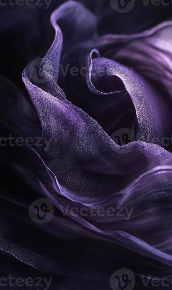Luxurious deep violet fabric cascades in soft waves, creating an opulent and ethereal texture photo