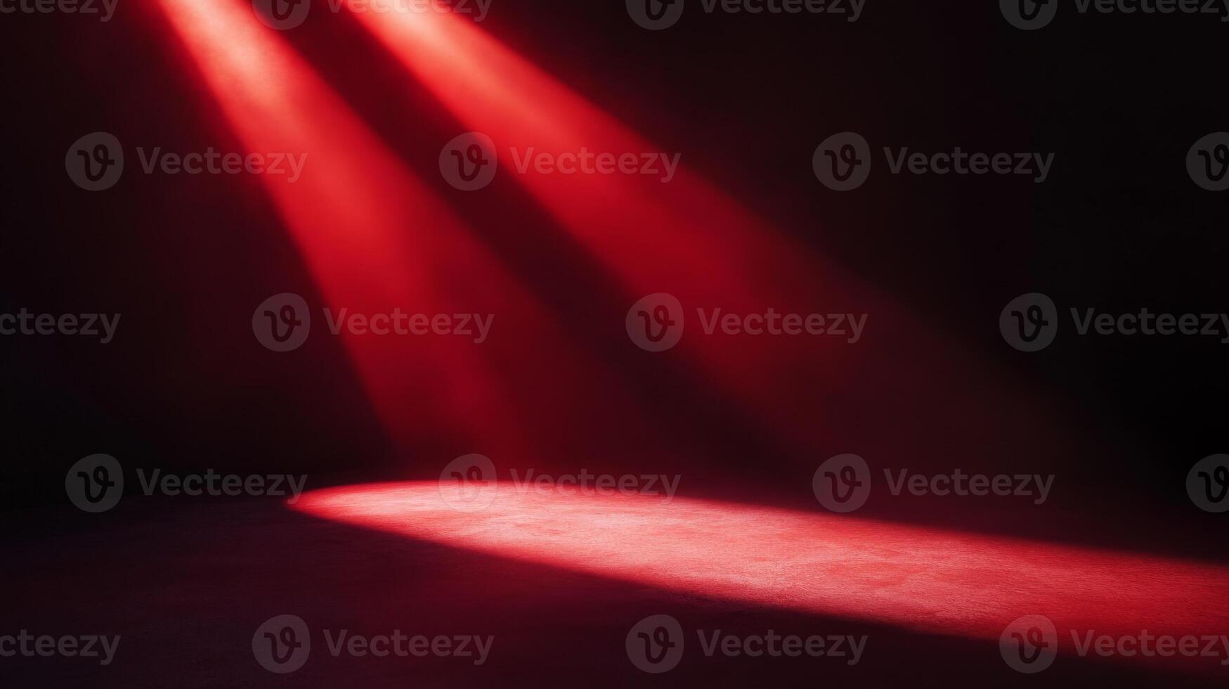 Crimson illumination highlighting a textured surface against a stark pitch black background photo