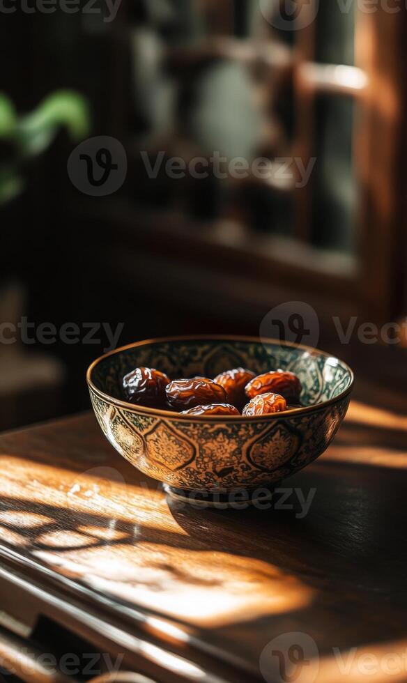 Still life of dates in patterned bowl with sunshine casting shadows on wooden surface photo