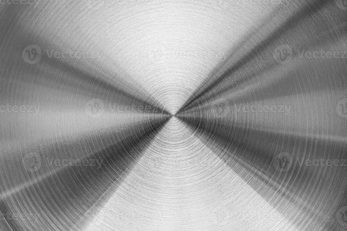 Aluminium circular brushed shiny metal texture. Abstract metallic background. Circle shape. photo
