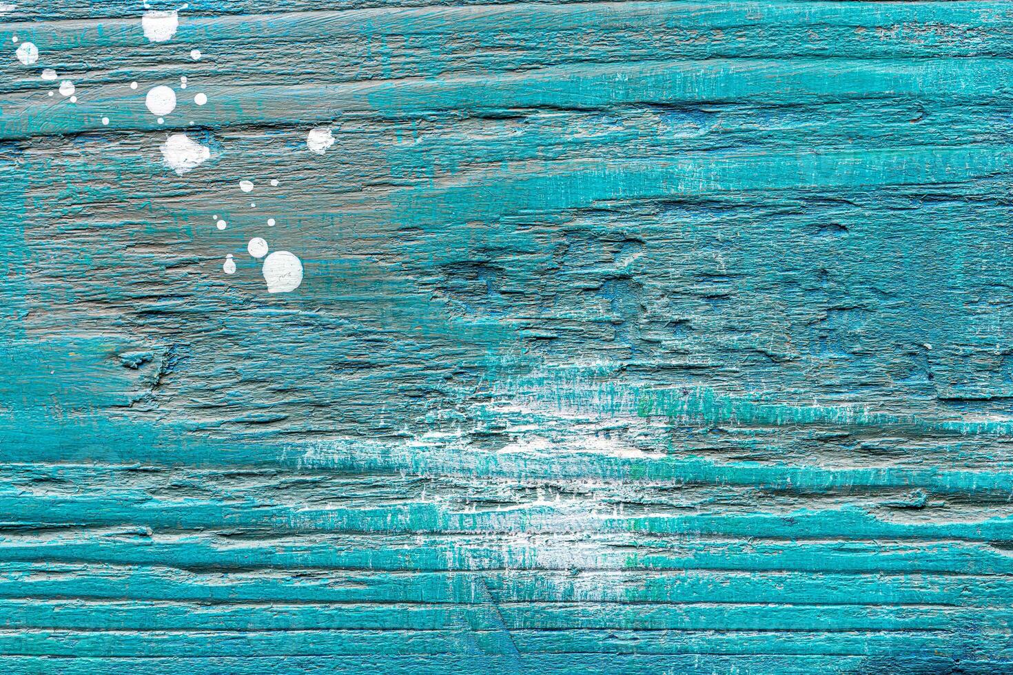 Painted textured wooden plank with colorful paint stains. Abstract backdrop for design. photo