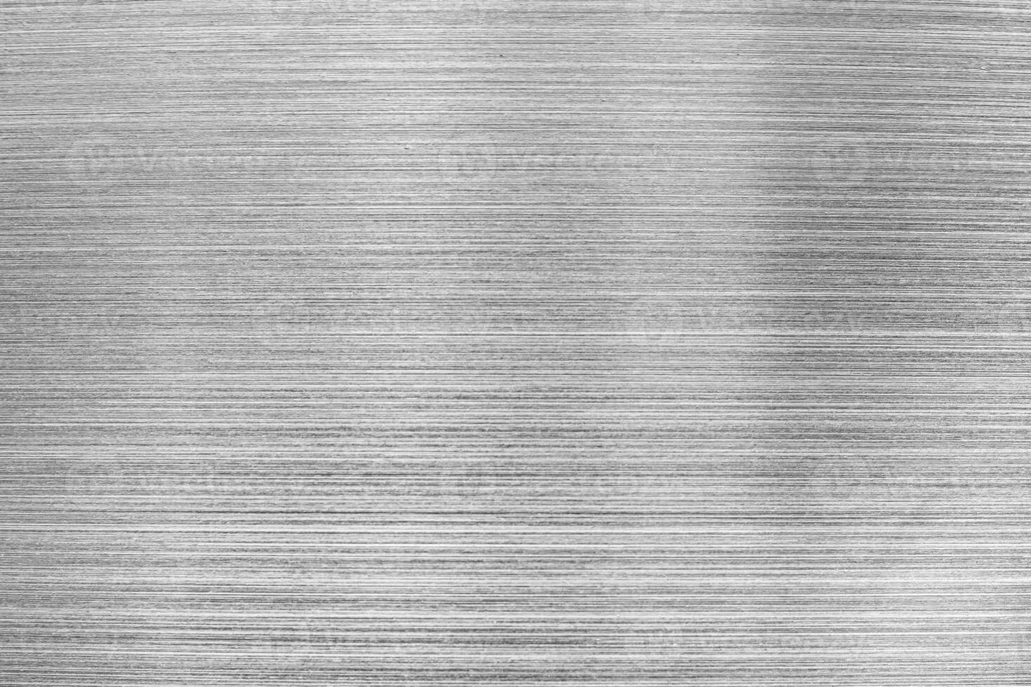 Monochrome texture of shiny scratched metal. photo
