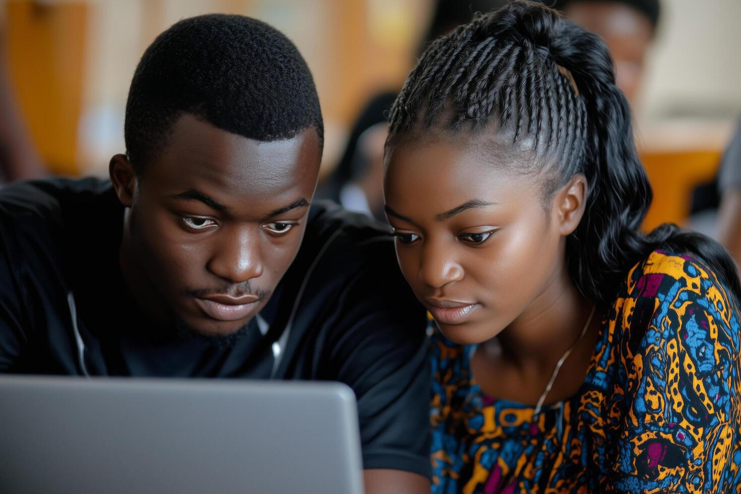 Young individuals engaged in collaborative learning at a modern workspace. photo