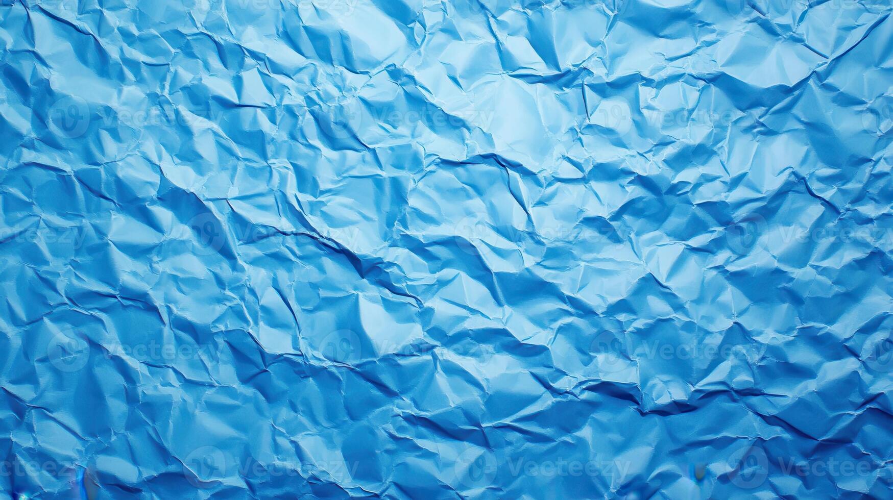 Crumpled blue paper texture, studio shot, background blur, design element photo
