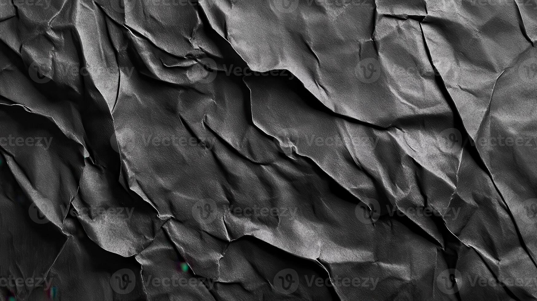 Crumpled dark paper texture, abstract background, design element photo