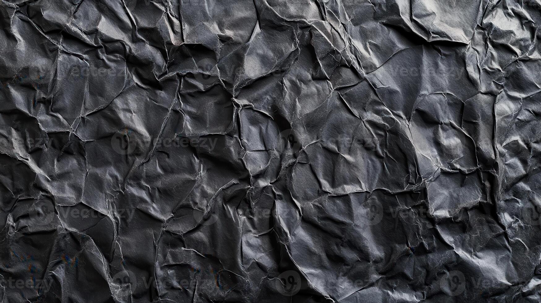 A black crumpled paper texture background photo