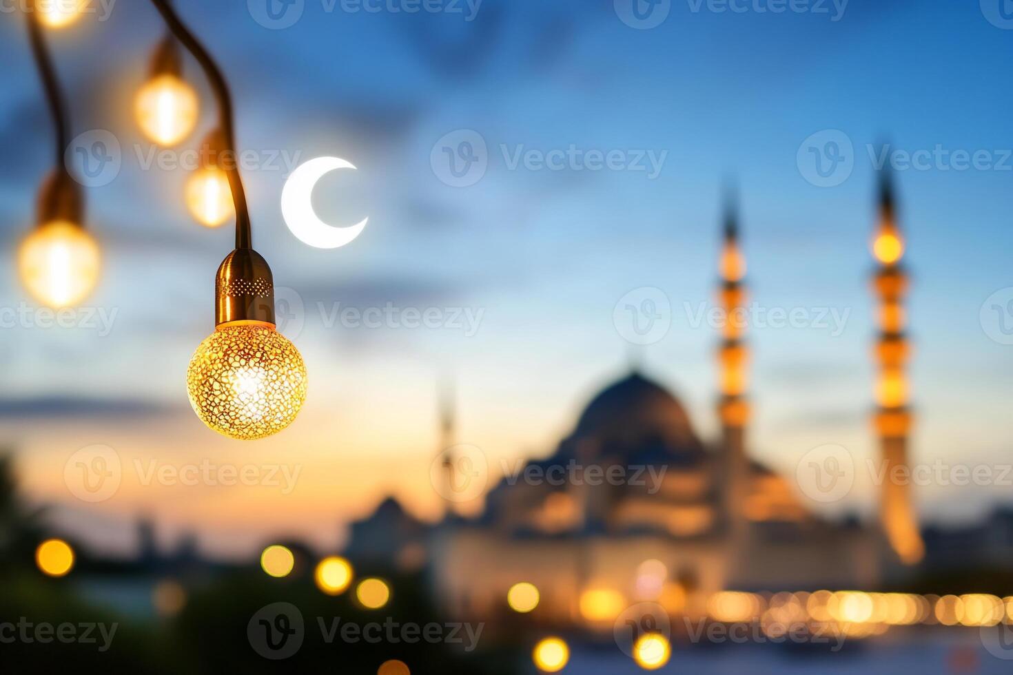 Illuminated mosque at twilight with crescent moon photo