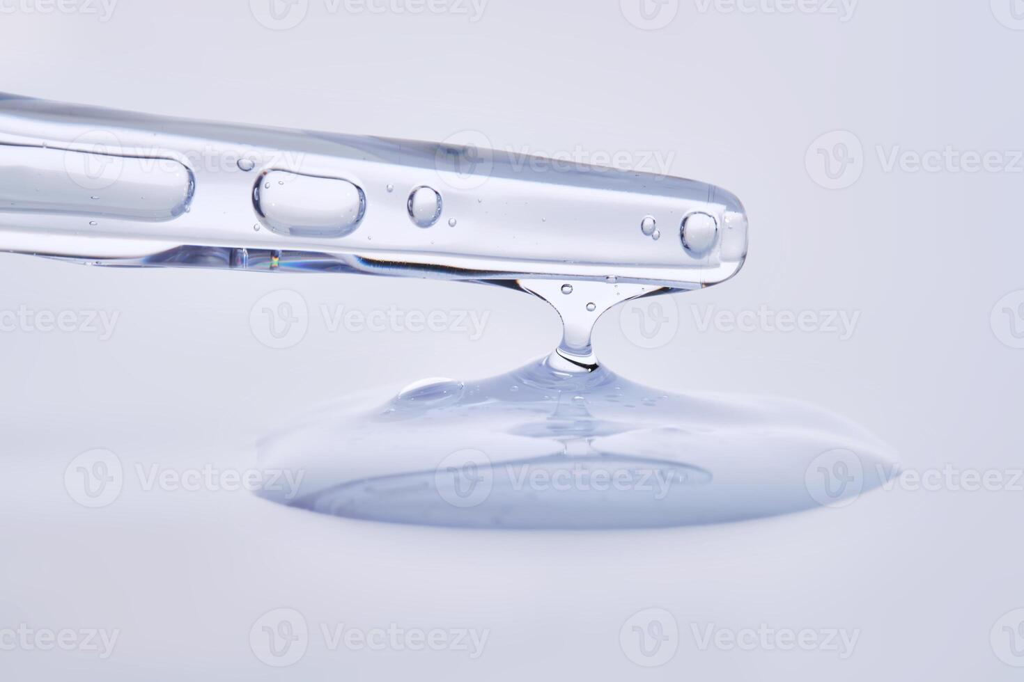 Pipette with delicate blue serum close-up. photo