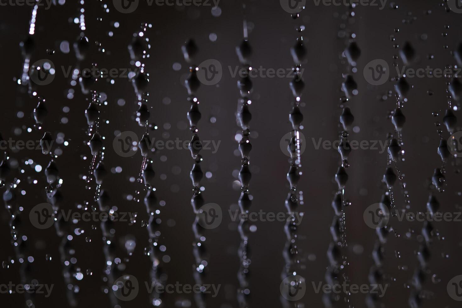 Abstract texture of water jets from the shower in close-up. photo