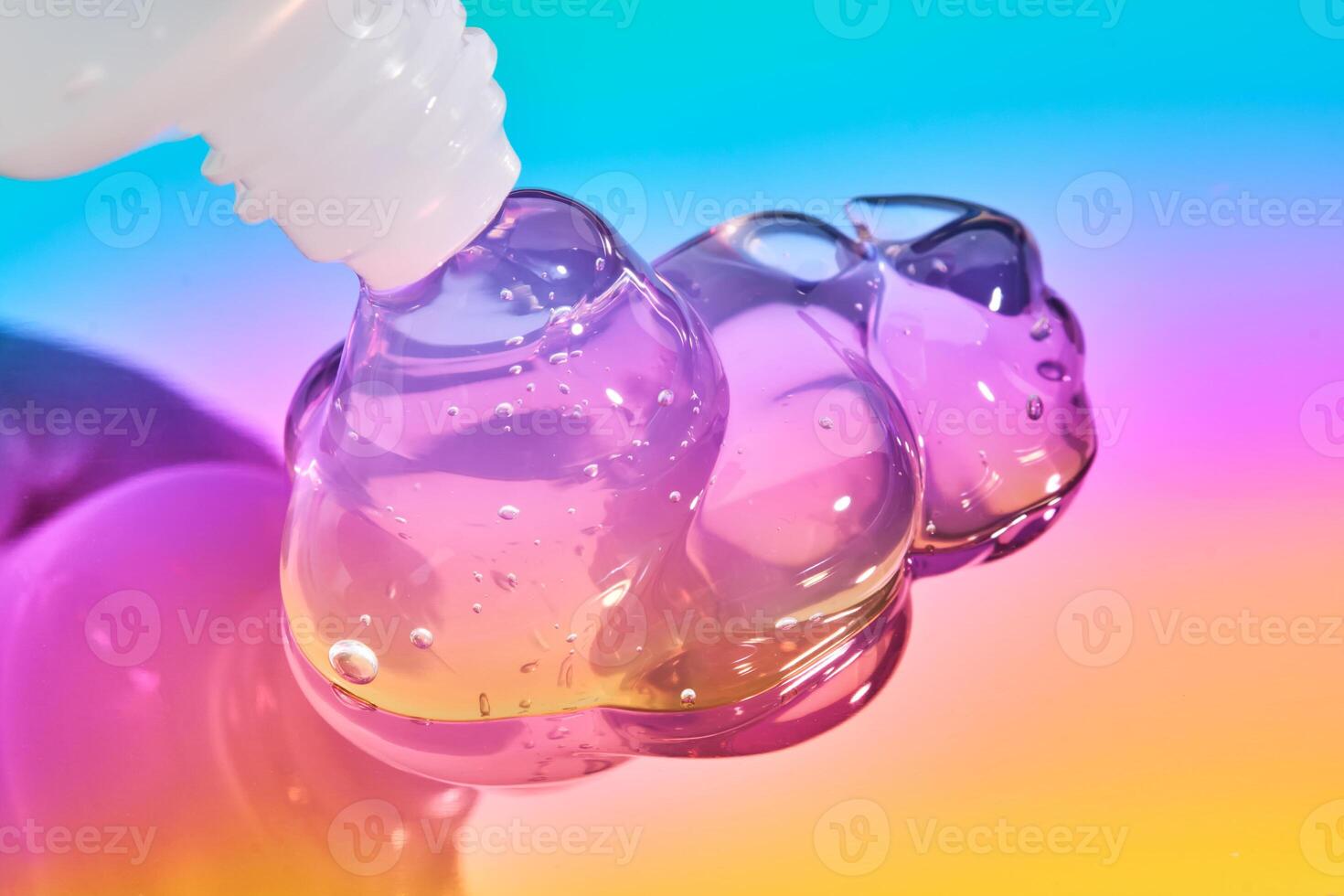 The texture of the cosmetic gel on a multicolored background. photo