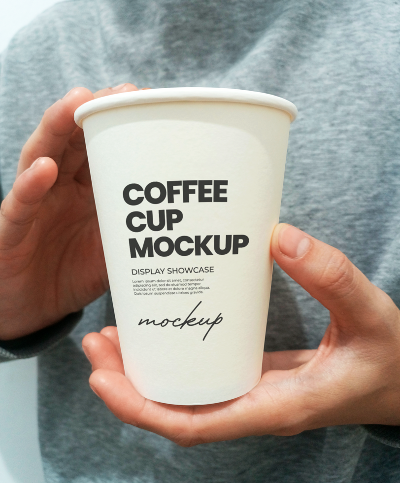 Paper cup on hand on white background front view psd