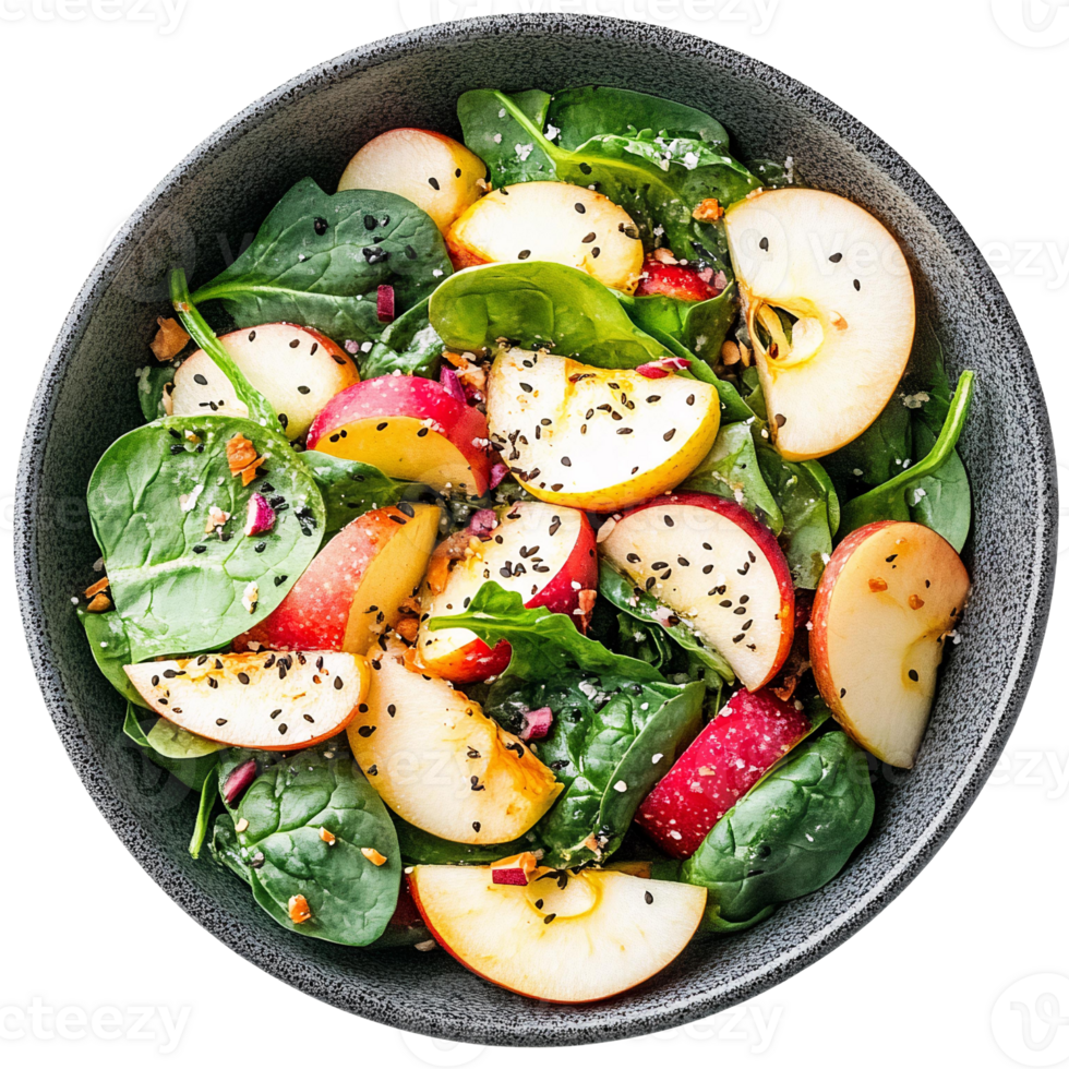 Apple spinach salad with black sesame seeds in a bowl on transparent background png