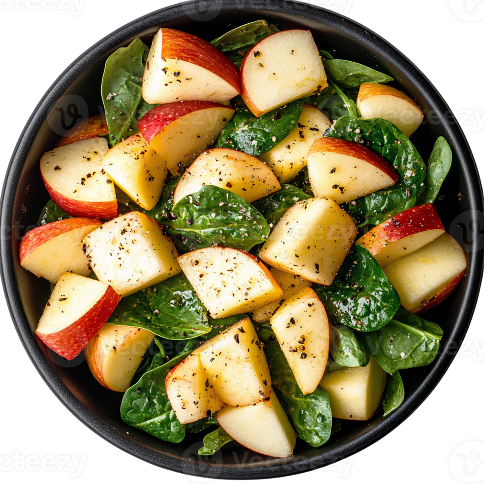 Apple and spinach salad with black pepper, overhead view png