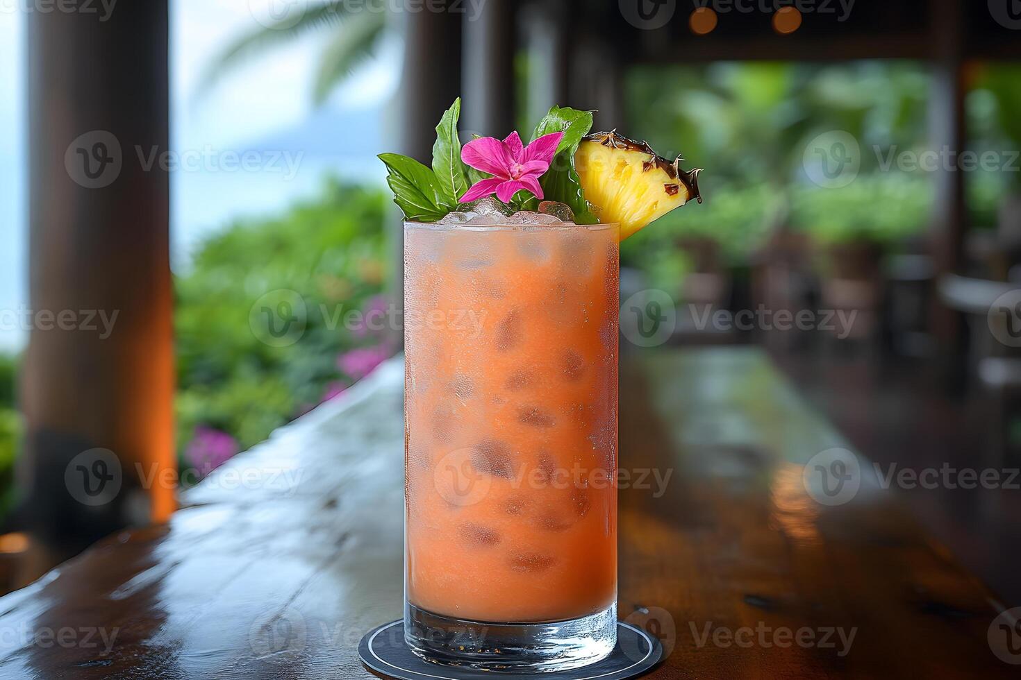 Tropical Vacation Drink with Pineapple and Floral Garnish on Wooden Table by the Beach photo