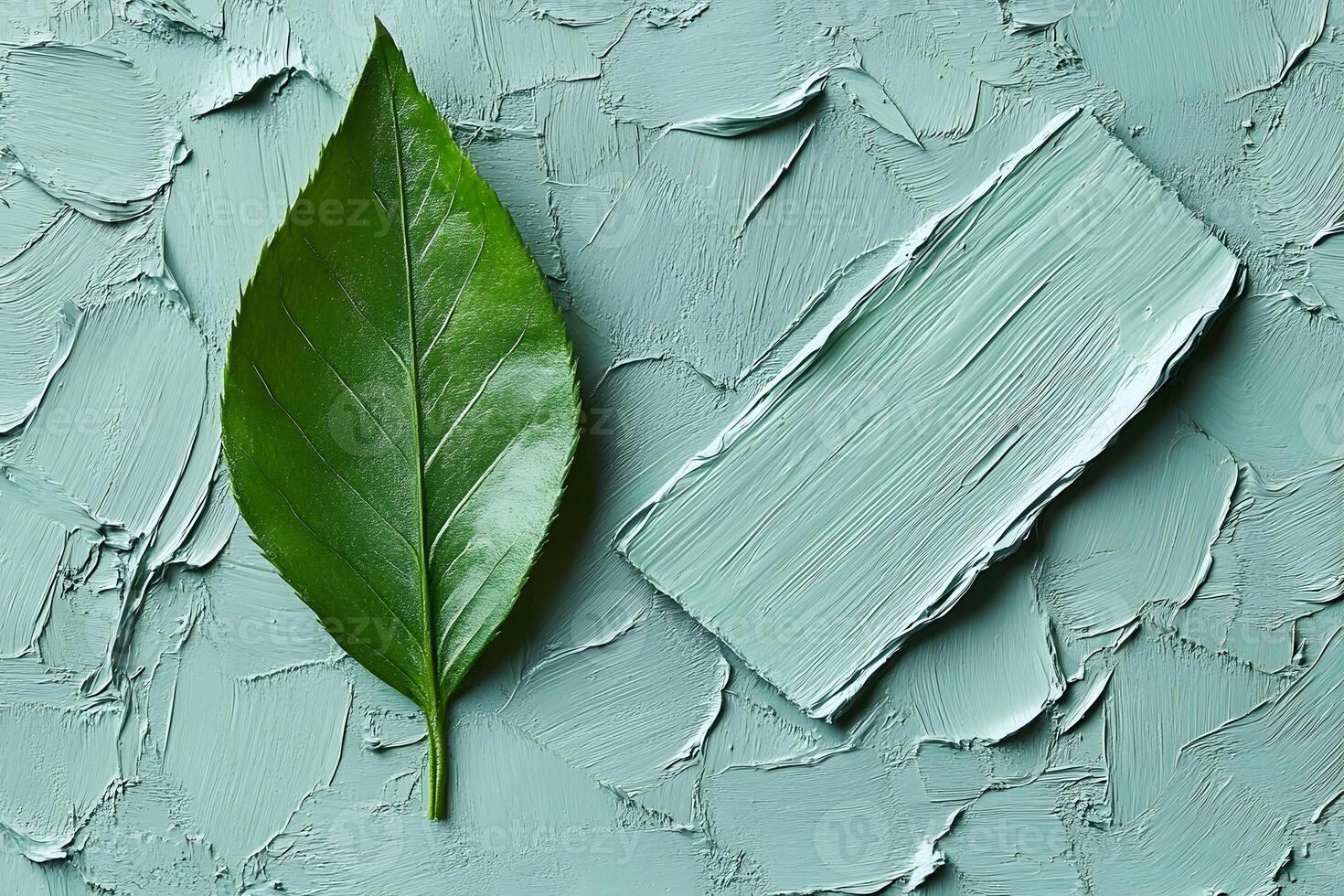 Green Leaf on Textured Green Surface for Nature and Design Concepts photo