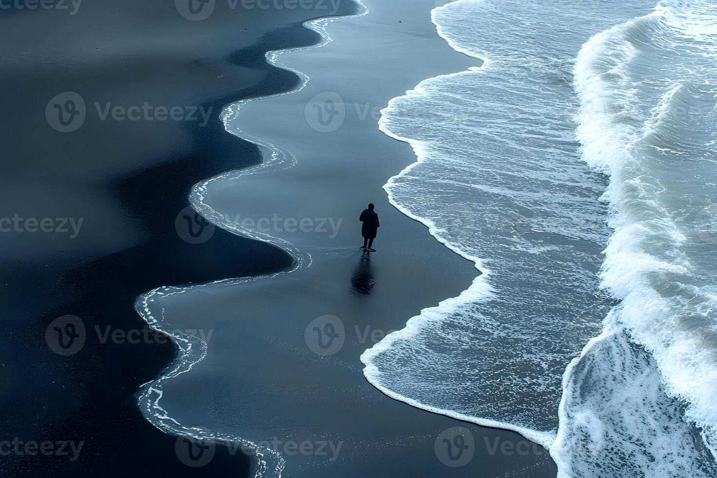 Serene Ocean Waves and Solitary Figure on Dark Sandy Beach photo