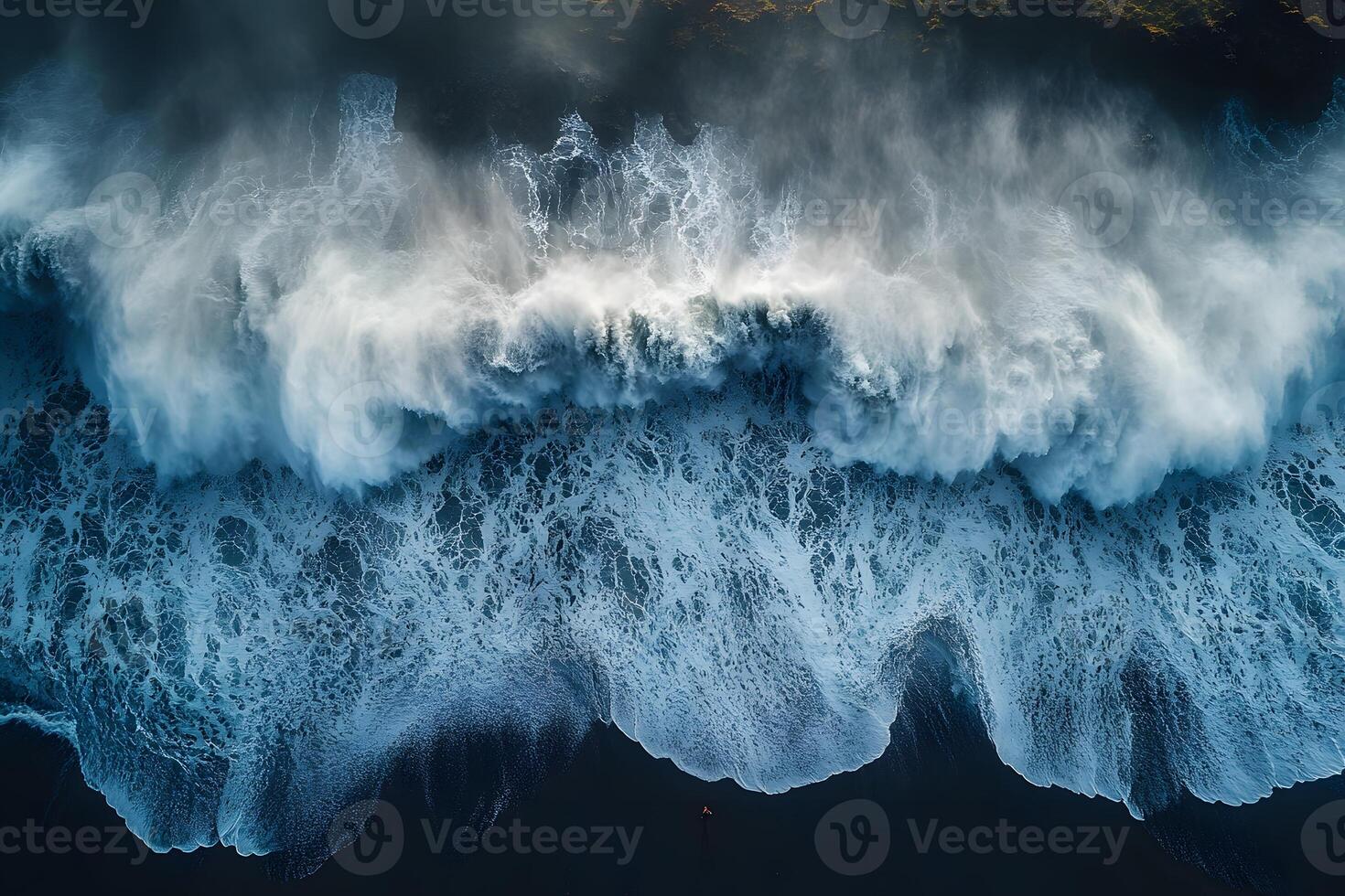 Majestic Aerial View of Ocean Waves Crashing on the Shoreline photo