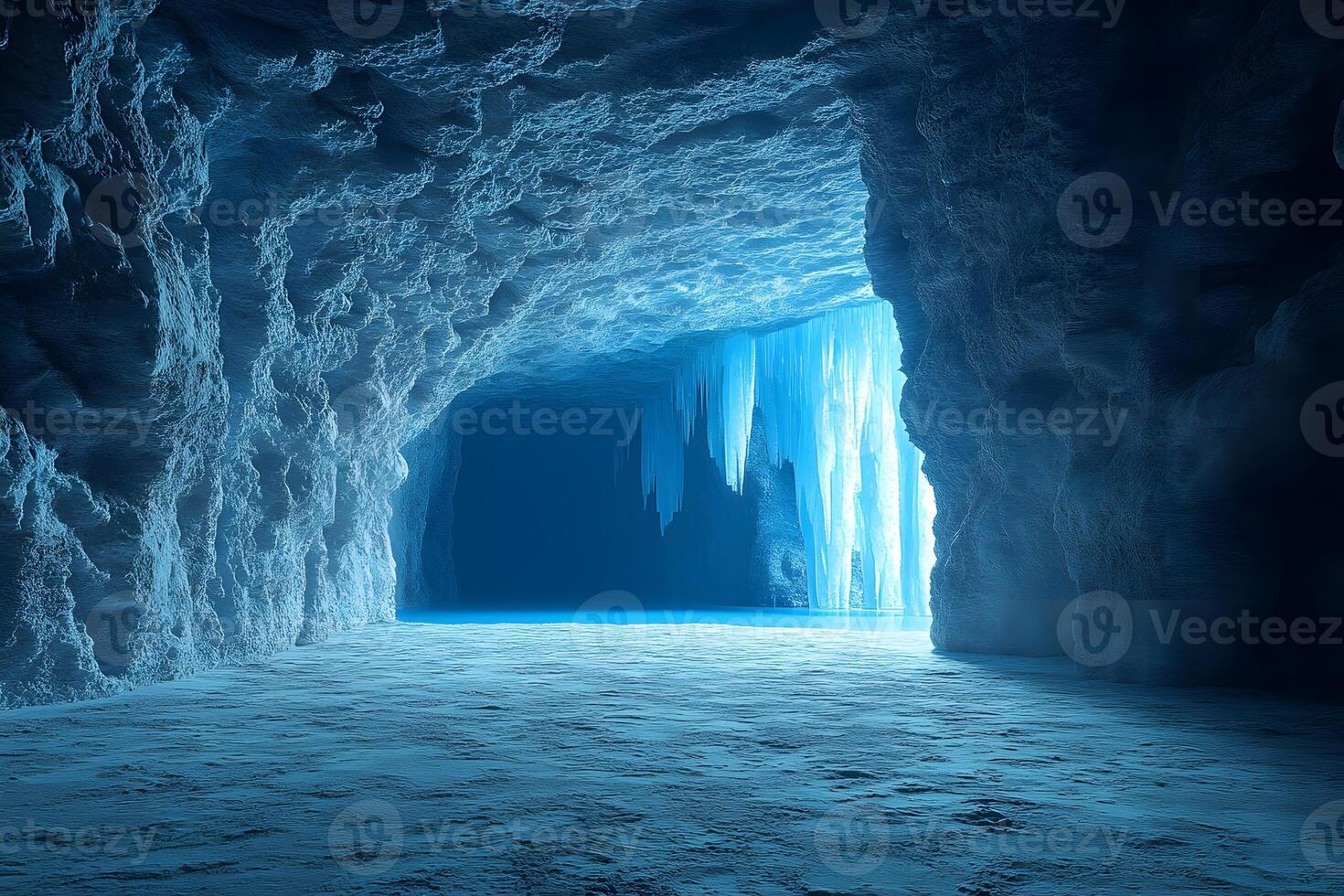 Mysterious Ice Cave with Stalactites and Blue Hues for Winter Design Inspiration photo
