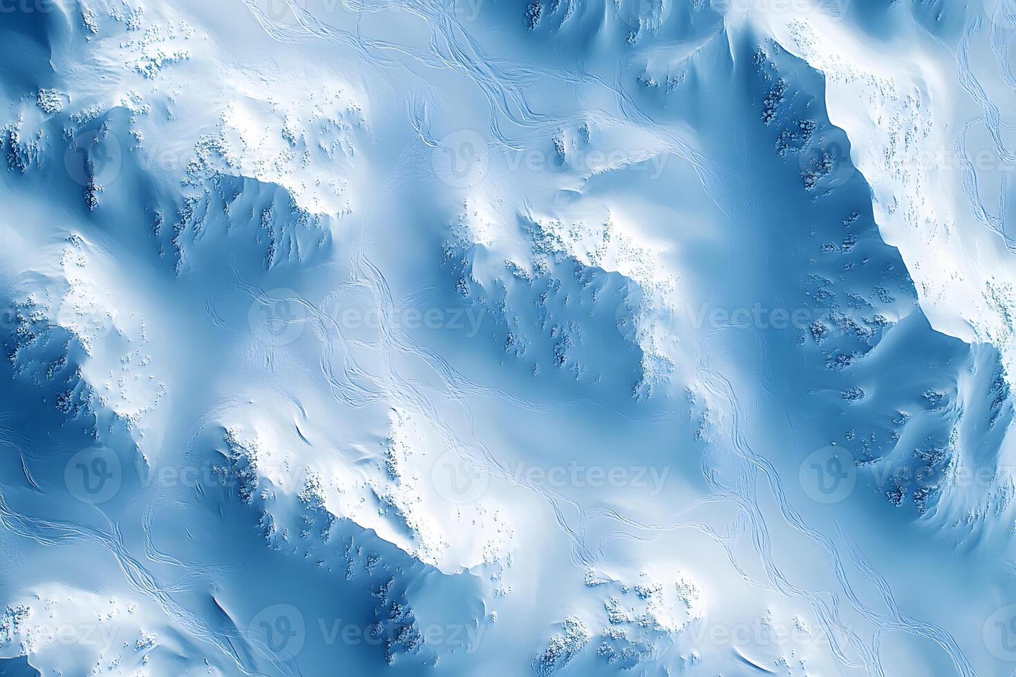 Aerial View of Snowy Mountain Landscape with Ski Tracks for Winter Adventure Concepts photo