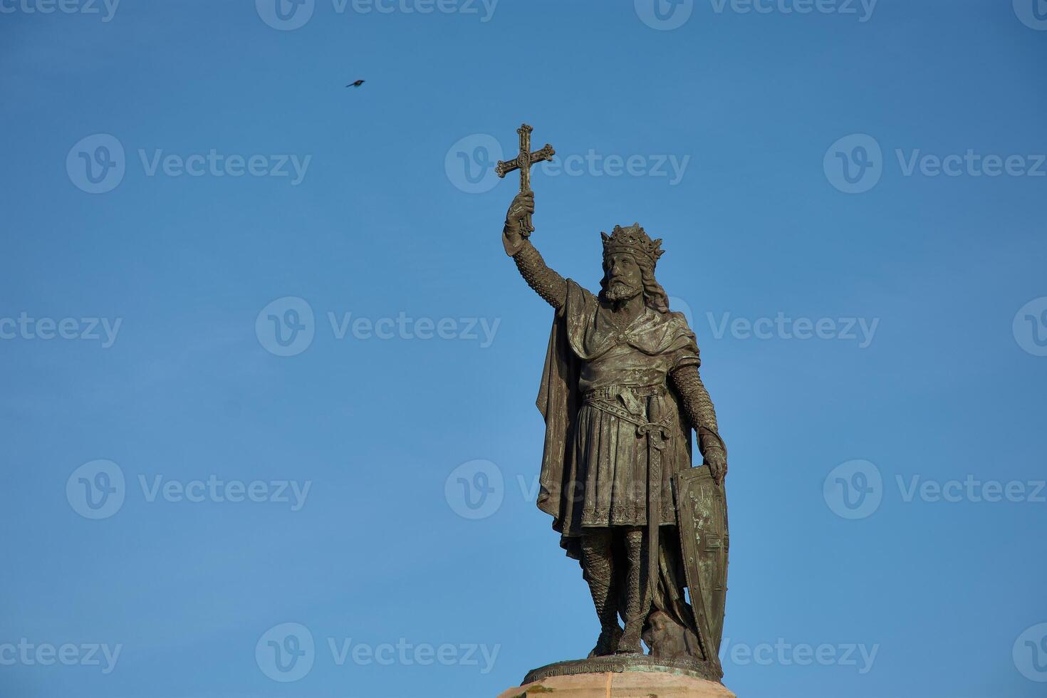 Historic monument of Don Pelayo, first king of Asturias, against a blue sky photo