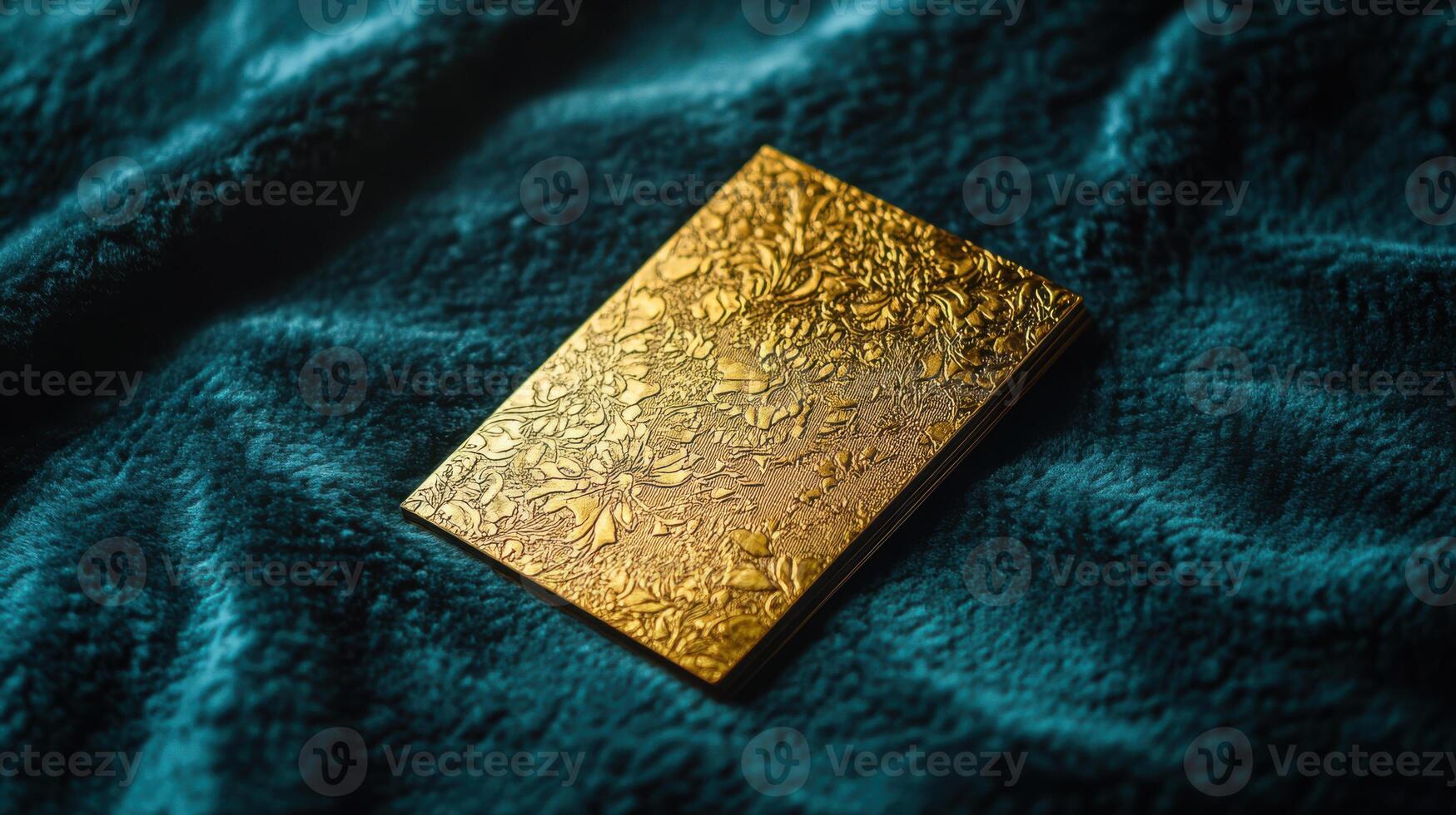 A gold card with a flower design on it photo