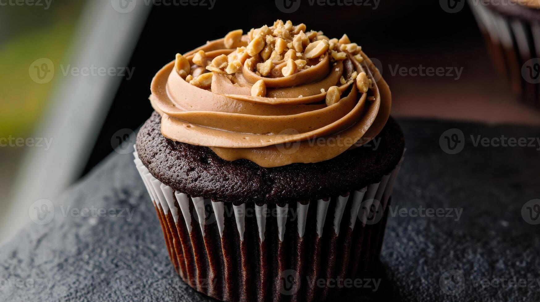 Delicious chocolate cupcake topped with creamy peanut butter frosting. photo