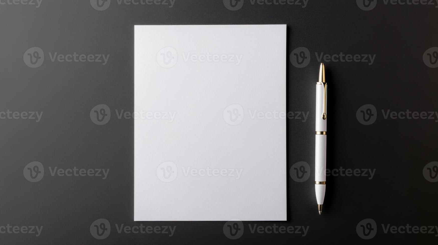 Blank white paper with pen on black background photo