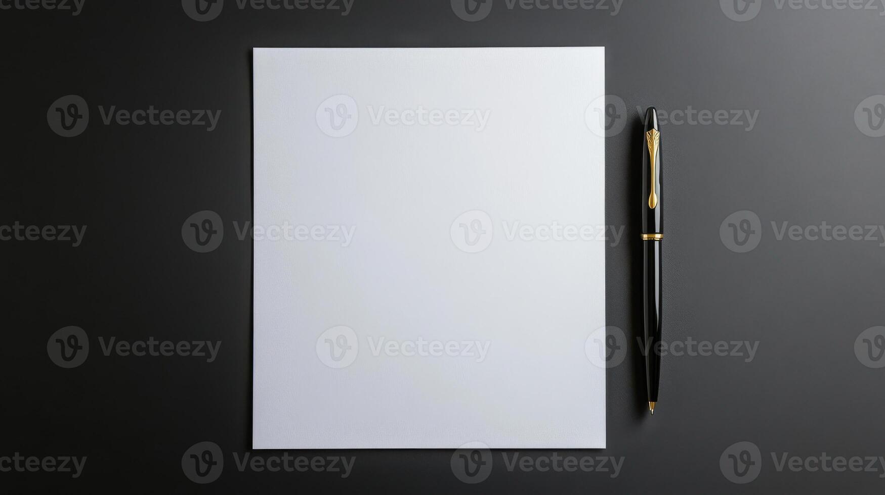 Blank white paper with pen on black background photo