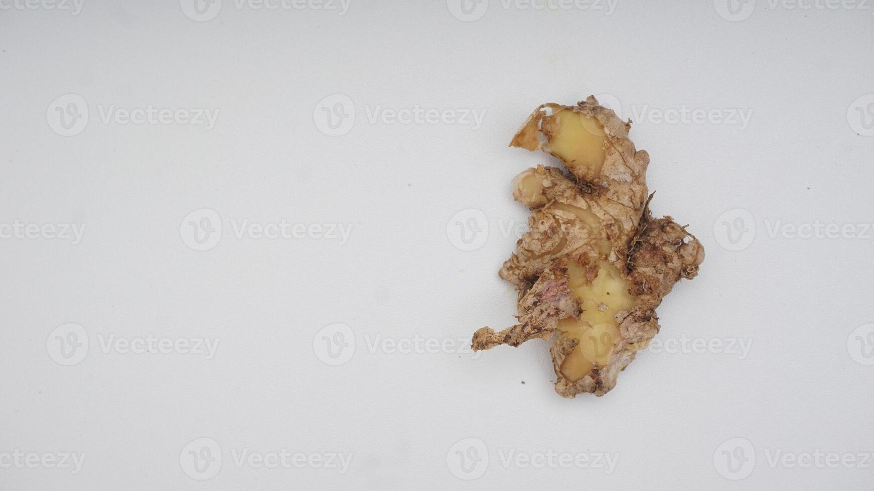Top View of Peeled Ginger Spice on White Background photo