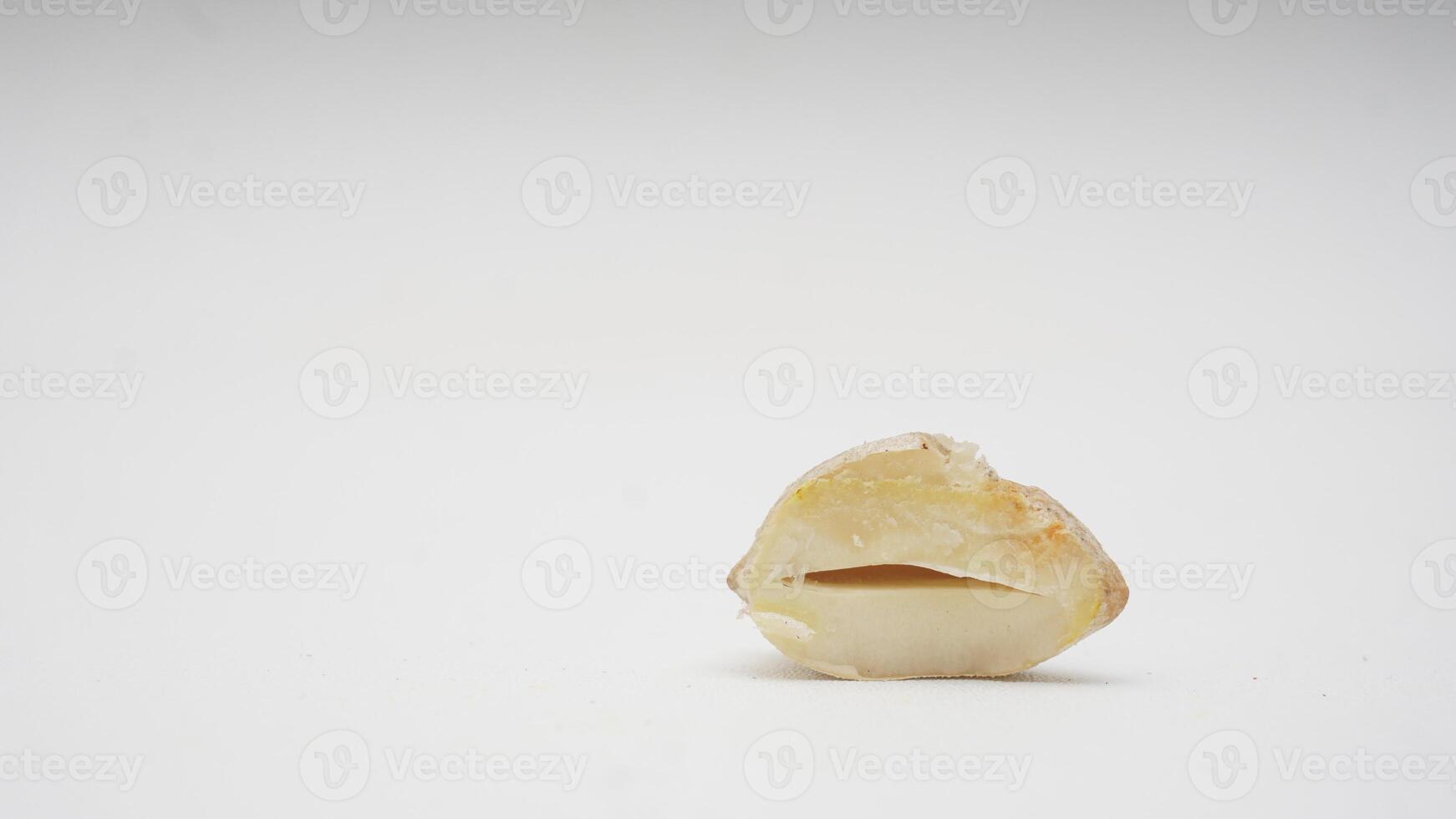 Cut in Half Candlenut or Kemiri on White Background photo