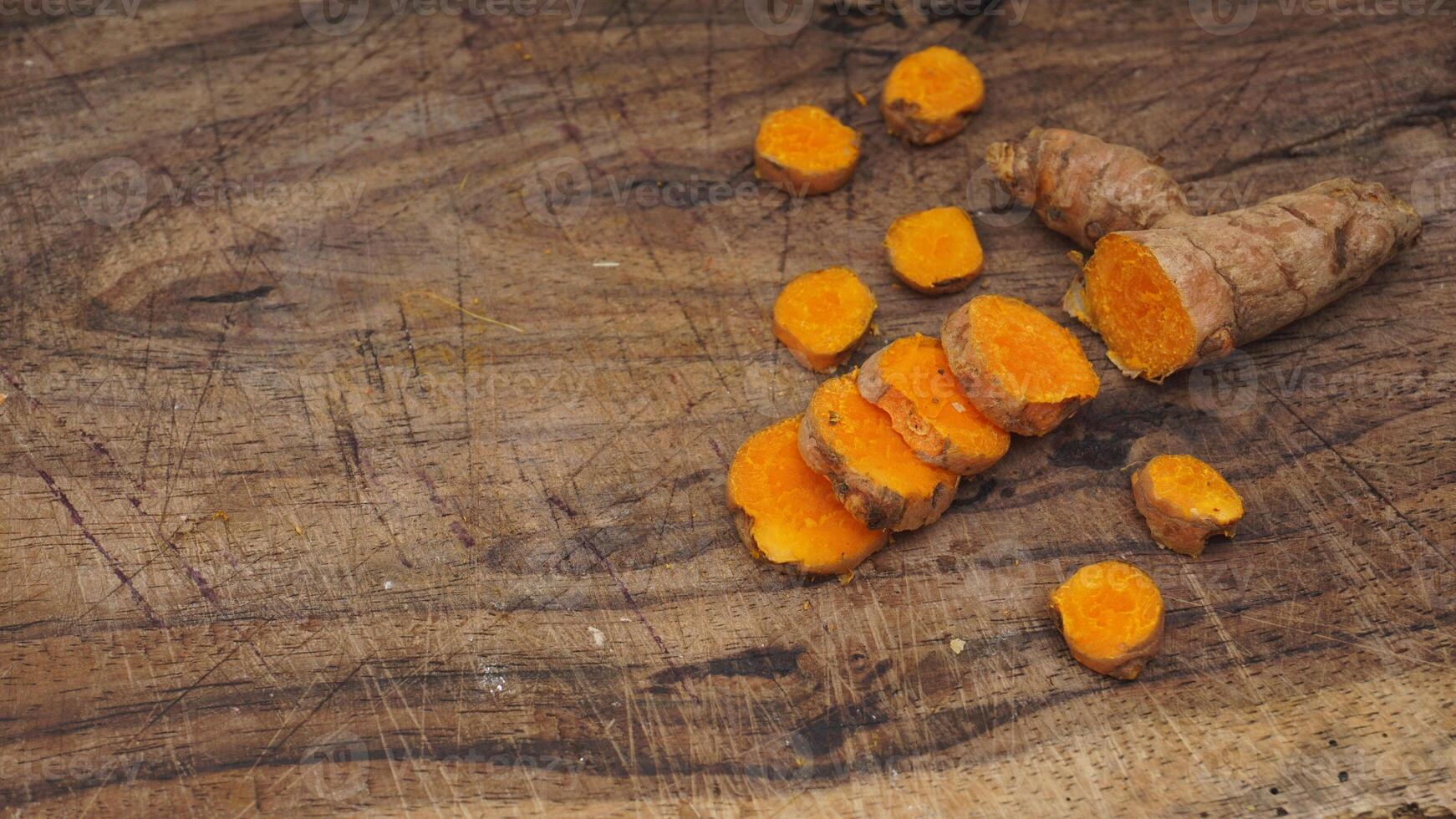 Turmeric Spice on Wooden Textured Background photo
