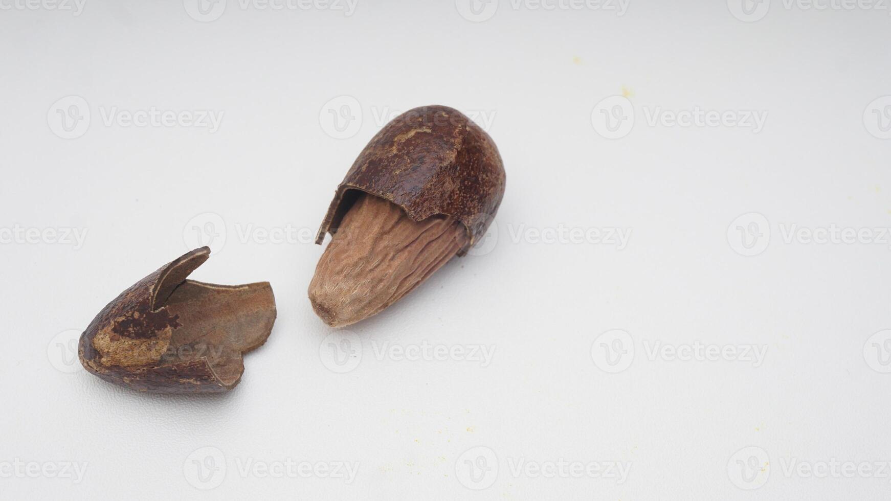 Dried Nutmeg on White Background photo
