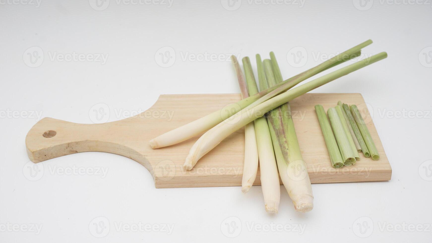 Lemongrass Herb on Wooden Cutting Board on White Background photo