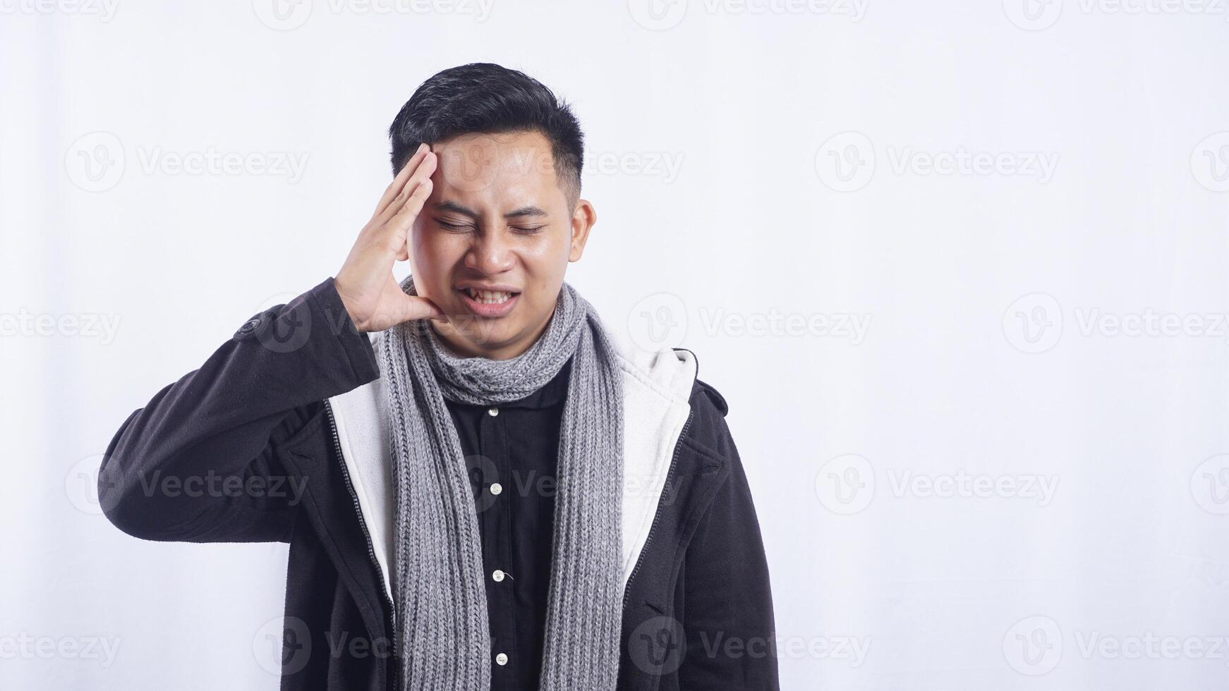 Sick Asian Man with Headache on White Background photo