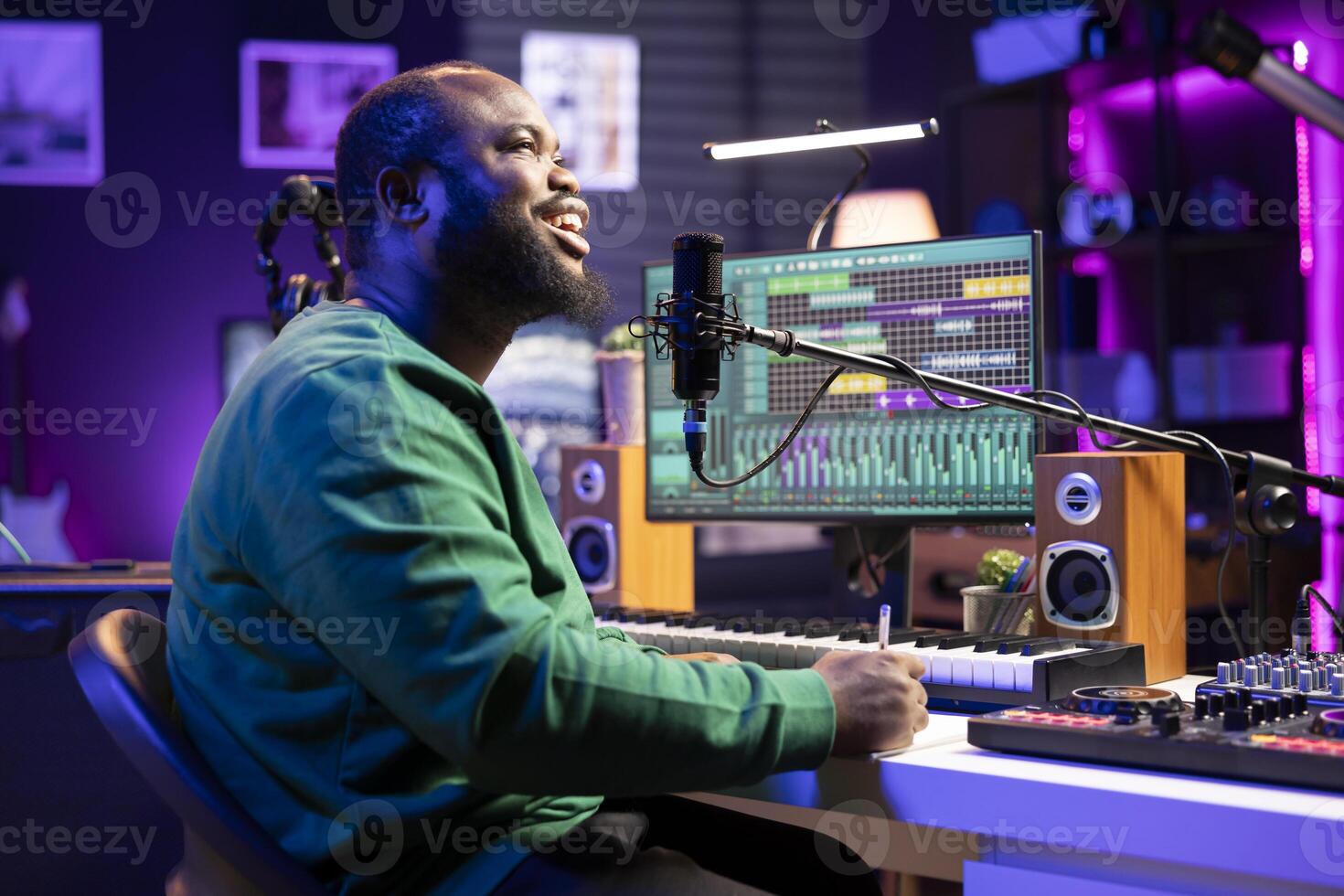 Professional musician producer composing a new song on paper, thinking about elements to blend together. Artist performer producing new music in home studio, chorus and rhymes. photo