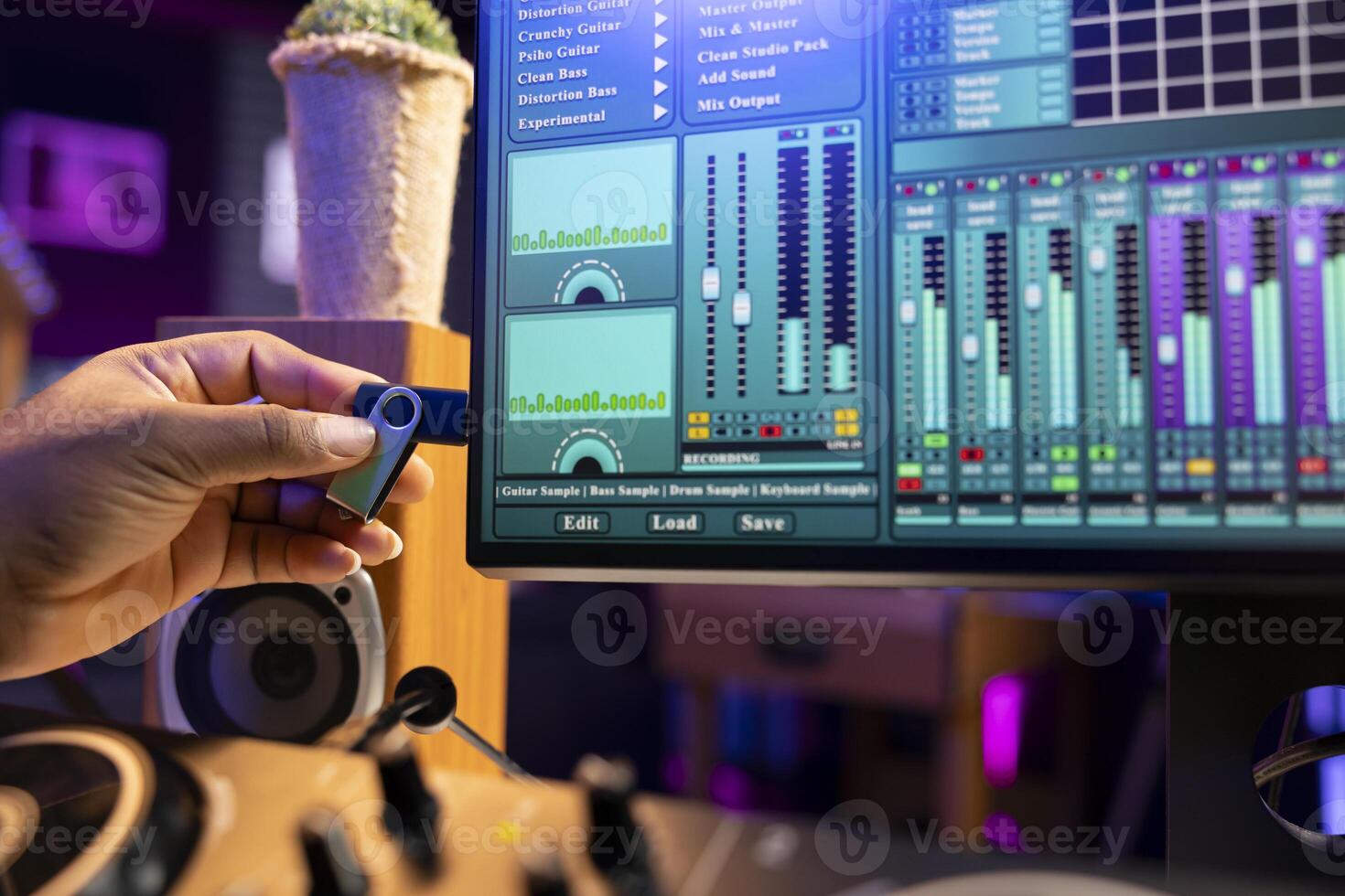 Sound designer copying audio recordings from an usb stick to start editing the tracks in post production, workstation in home studio. Mixing and mastering songs for the music industry. Close up. photo