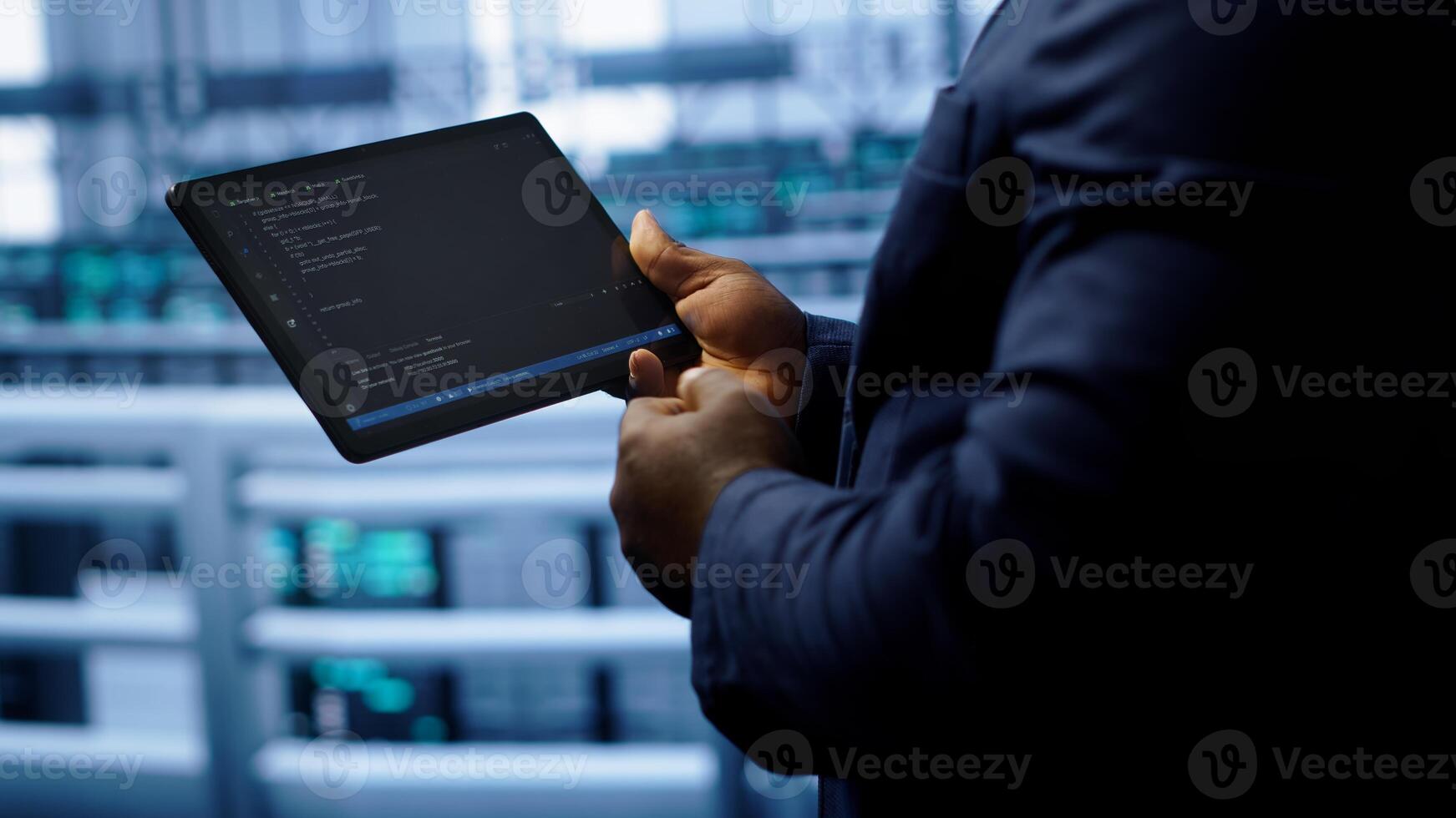 Engineer in high tech facility using tablet to patch network issues leading to slow data transfer rates. Close up of worker fixing errors affecting servers performance and connectivity, camera A photo