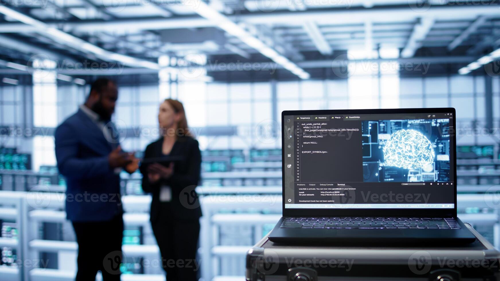 Focus on laptop in data center with artificial intelligence brain used by engineers in blurry background. Close up of device displaying AI deep learning software in server farm, camera B photo