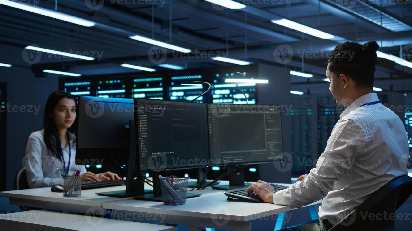 Data center technician responsible for installation and repair of networking equipment solving tasks. IT specialist doing maintenance on server room infrastructure, camera B photo