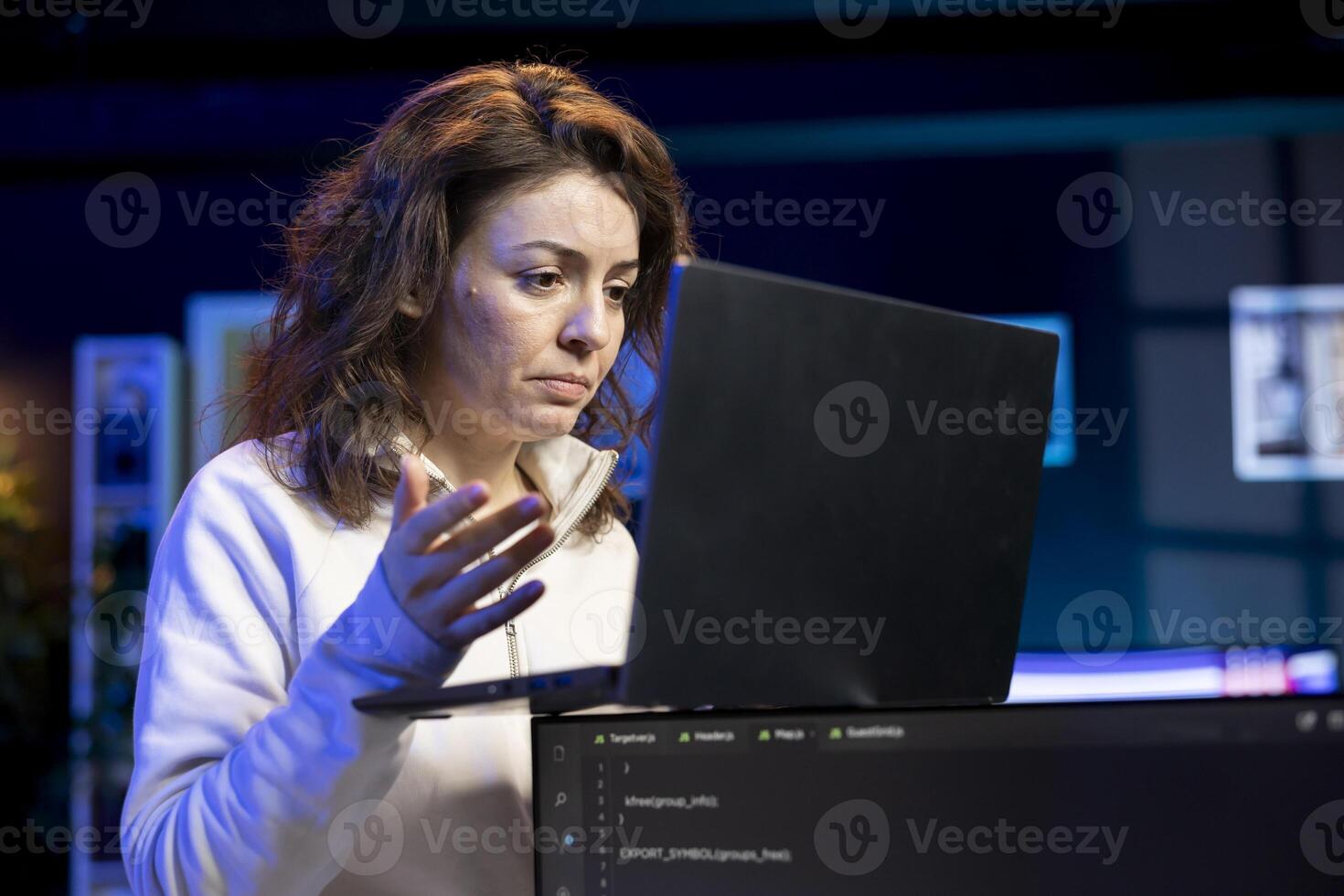 Computer engineer in apartment designing and developing software applications on laptop. IT professional typing on notebook device keyboard, implementing and maintaining company systems photo