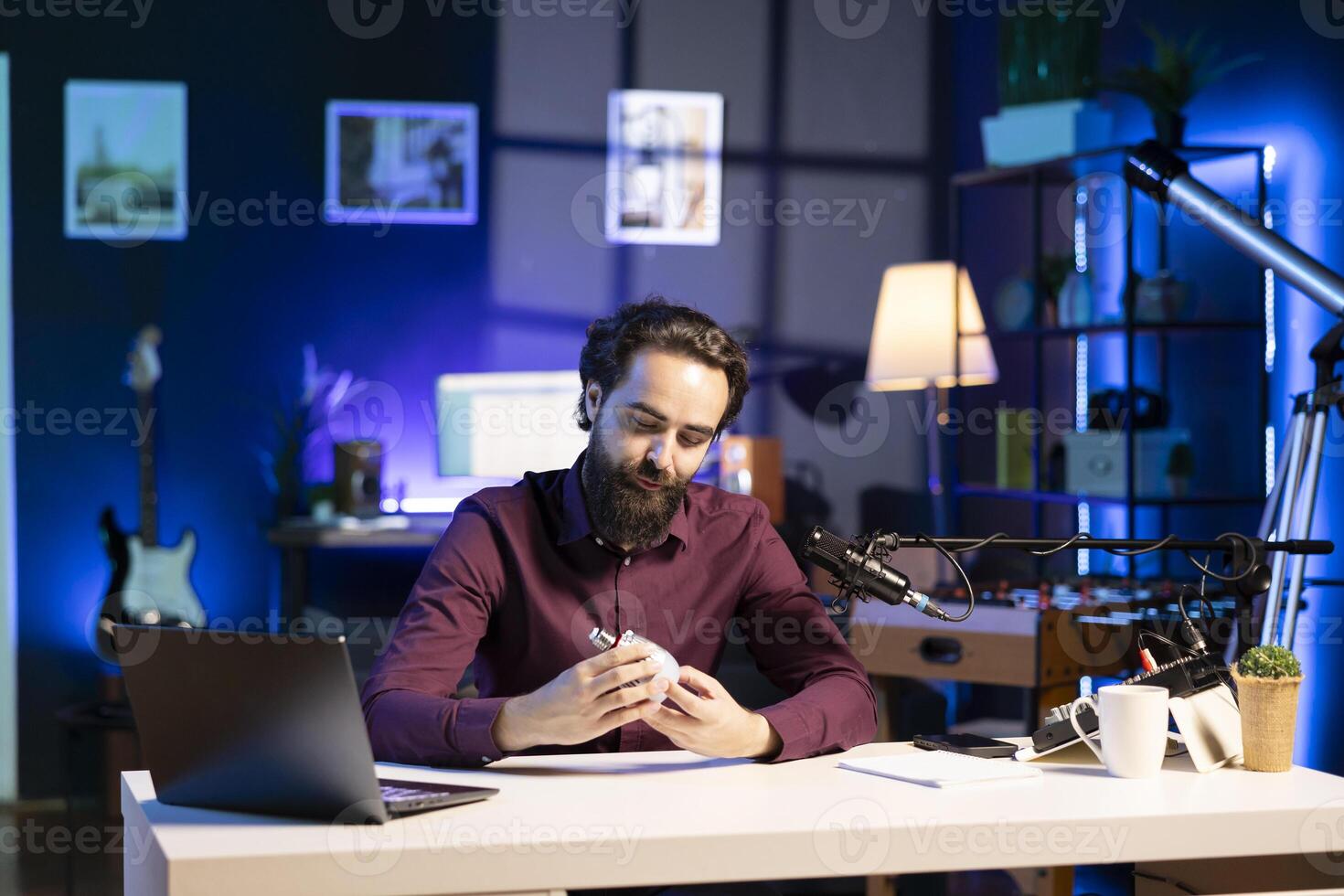 Tech expert repairing smart light bulb live on online streaming platforms. Internet star hosting show for technology enthusiasts, fixing IoT home automation product in studio photo
