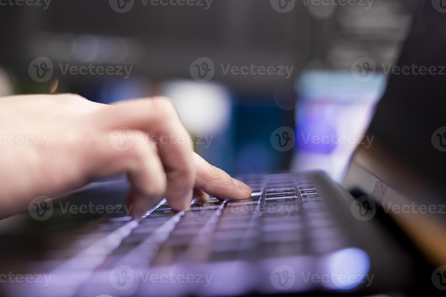 Programmer typing on keyboard, designing and developing software programs, extreme close up shot. Remote IT employee implementing and maintaining company systems on computer photo