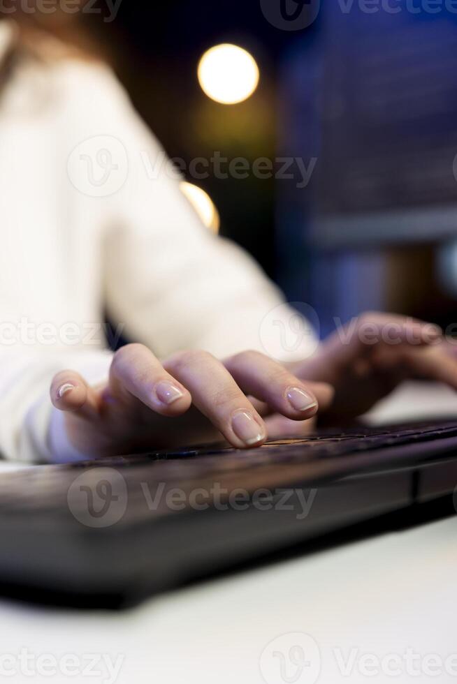 Freelancing computer scientist typing on keyboard, implementing security measures to protect company data. Close up shot of remote IT worker testing and debugging code for software applications photo